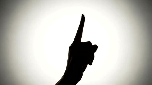 Hand Pointing Upward Silhouette Idea Concept