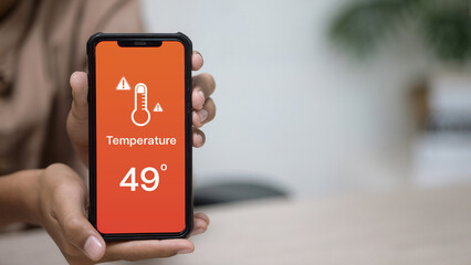 Smartphone Showing Extreme Hot Weather Temperature Warning 49 Degrees Celsius