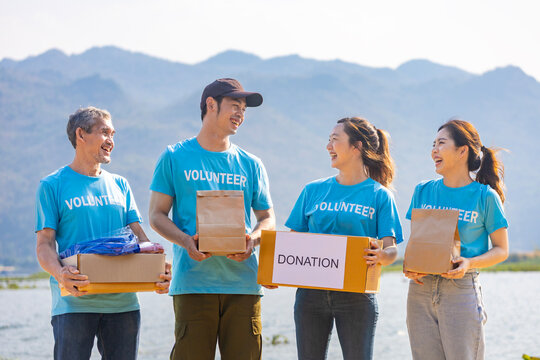 Group of volunteer people joining together in money raising event for donation in the charity work and ngo activity such as global warming, environmental issues, pollution and eco-friendly project