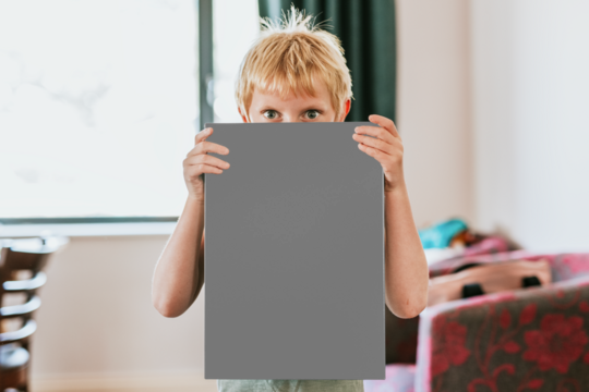 Sign png mockup, held by a boy, blank design space