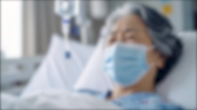 ぼかし背景素材: 入院中のシニア女性  病院のベッドに横たわり病気の治療を受ける高齢者のイメージ