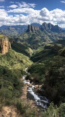 Obraz premium A meandering river carves a path through a lush, green valley, framed by towering cliffs and rugged mountains under a bright, cloudy sky