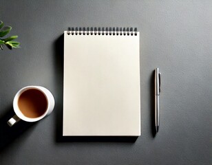  Blank notebook and coffee cup with pen on gray background white background 