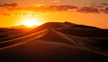 Fototapeta premium Dramatic dune silhouette at sunset with warm light 