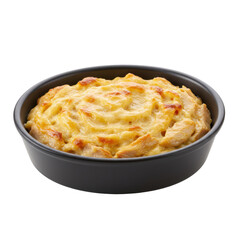 Creamy chicken casserole in black bowl swirled cheese topping isolated on white background