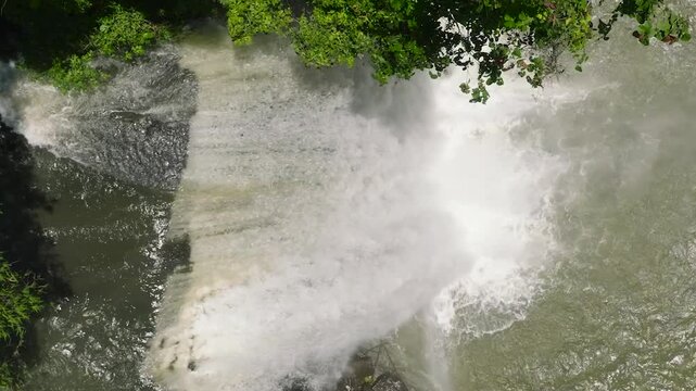 Flying from above the Hikong Alo waterfall of Lake Sebu. Beautiful cascades in the forest. Mindanao, Philippines.