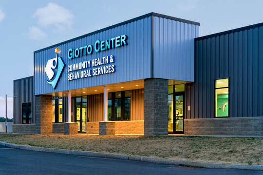 Utica, NY - Aug 16, 2025: Night view of Giotto Center, is a comprehensive Community Health and Behavioral Services facility, offering integrated care for individuals of all ages