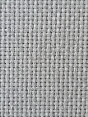 the texture of the white thread stitching that forms the fabric