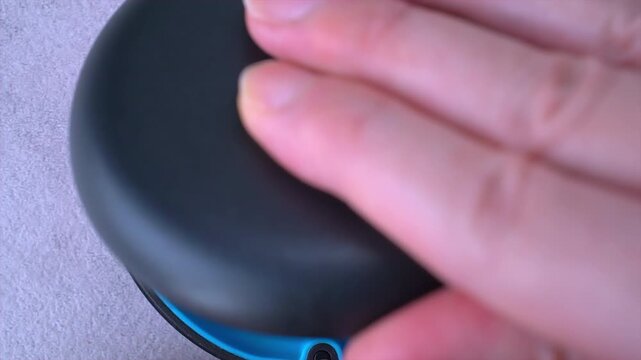 Opening blue dental aligner case that are  orthodontic mouthpiece storage in marble background. Close-up video.