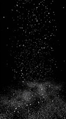 Abstract illustration of specks of white light falling onto a darkened surface. It gives the sense of light, dust, or snow over a grainy, dark background