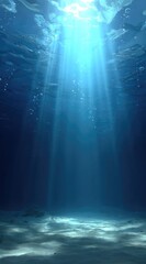 An underwater scene with sunbeams piercing through the water towards the sandy seabed, creating a calming and ethereal atmosphere