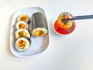 Kimbap(gimbap) made with various ingredients such as rice and eggs.