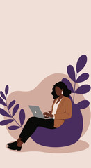 Professional African American woman comfortably working on a laptop from a flexible workspace, embodying remote work and modern business lifestyle.