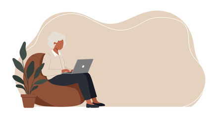 Senior woman comfortably uses laptop at home. Modern digital lifestyle, remote work, or online education concept. Ideal for themes of active retirement and technology.