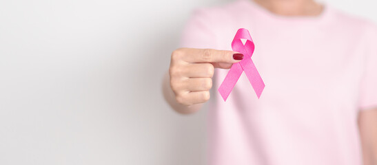 Elderly woman with pink Ribbon for Pink October Breast Cancer Awareness month, May Women Health, February World cancer day, support people life and illness. National cancer survivors month