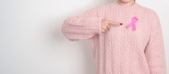 Pink October Breast Cancer Awareness month, woman with pink Ribbon for concepts of support people life and illness. National cancer survivors month, Women Health day and February World cancer day