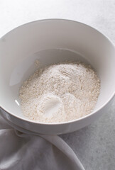 top view of spicy cracker dough being mixed in a bowl, process of making fire crackers