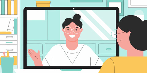 Two women having a video call conversation on a laptop in a modern office setting