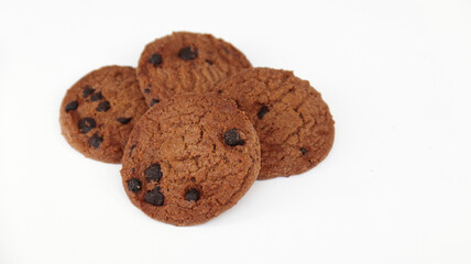 Isolated clipping path of die cut dark chocolate chip cookies on white background. Closeup tasty bakery organic homemade American biscuit sweet dessert