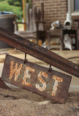 Metal Sign With Word West Outside of Rural Store in Texas