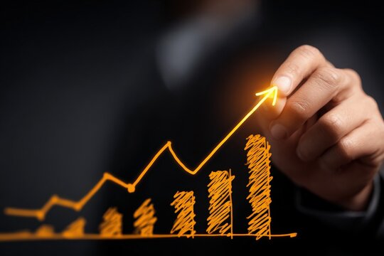 A hand drawing a rising graph