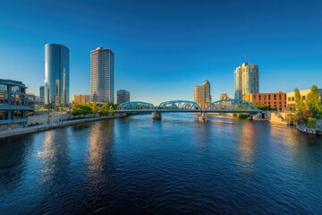 Naklejka premium City skyline reflected on a river, with a bridge in the foreground
