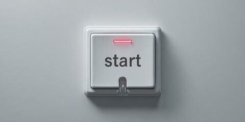 White start button with red indicator light