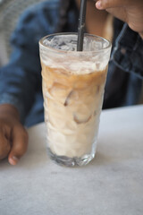 Child Enjoying a refreshing iced coffee on a sunny day