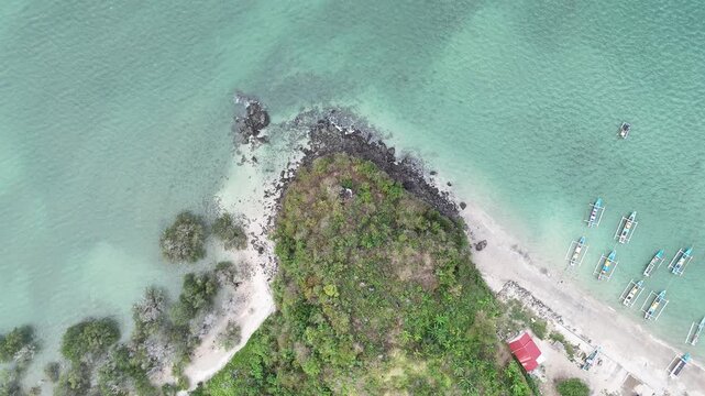 Aerial Top Down View of Tropical Peninsula and Turquoise Ocean with Traditional Boats