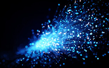 Fototapeta premium Close-up view of vibrant blue fiber optic cables emitting light