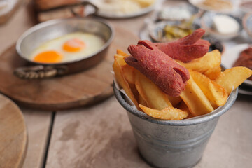Delicious fries and sausages served in a rustic setting