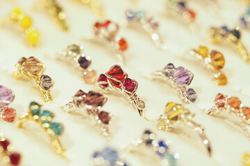 Colorful gemstone jewelry displayed in a vibrant market