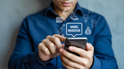 Man in blue shirt using smartphone with angel investor graphic overlay and business related icons around