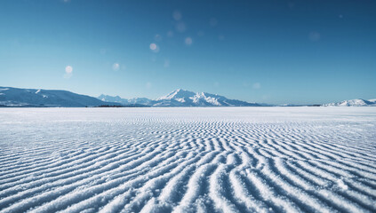 Snow covered plains with distant mountains winter landscape