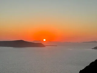 Selbstklebende Fototapeten Santorini Sunset over Santorini in the Aegean Sea, one of the many islands scattered in the Mediteranean around Greece, each one full of historical and mythological stories spanning more than 3000 years  © Helge