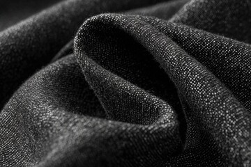 Close-up view of dark gray denim fabric texture