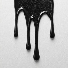 Dripping black liquid on white background