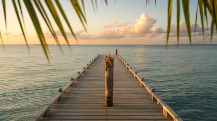 A tranquil scene of a wooden pier stretching out into the calm ocean at sunset, framed by palm leaves, evokes a sense of peace and escape to a tropical paradise