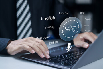 Ai translate language concept. Automatic translation system, Artificial intelligence technology helps translate languages. Businessman using laptop with virtual icon.