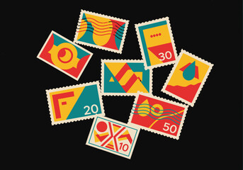 Obraz premium Colorful Collection of Vintage Postage Stamps with Geometric Designs and Numbers.