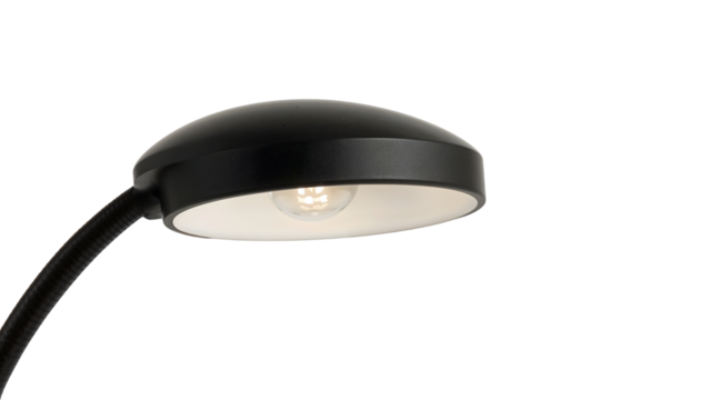 Modern black desk lamp with curved neck and minimalist shade isolated on the transparent background for office or home decor