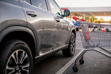 Parked vehicle with paint damage done by runaway shopping cart. Insurance themed stock image for collision loss, premises liability and Comprehensive claim