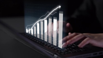 A focused view of hands typing on a laptop while an animated graph showcases impressive financial growth trends, emphasizing data analysis in a modern workspace. Copula - Powered by Adobe