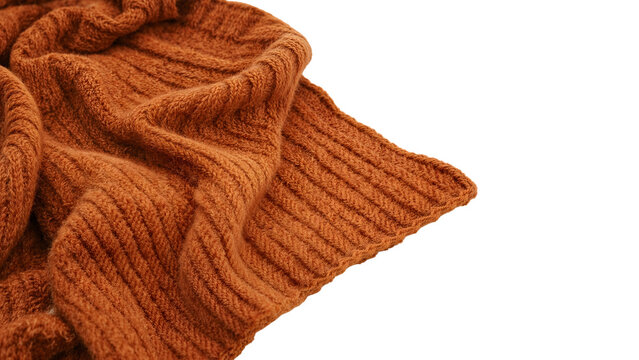 Closeup of cozy brown knitted wool blanket with ribbed texture on the transparent background for autumn and winter comfort