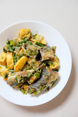 Indonesian homemade food, fried fish with green chili or sambal ijo