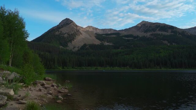 Paddleboarding Lost Lake shoreline Beckman Mountain campground Kebler Pass sunset golden hour spring summer aerial drone Crested Butte Colorado Ruby Peak Paonia Gunnison National Forest forward