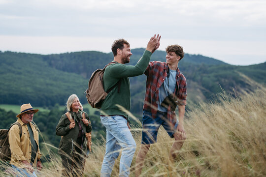 Multigenerational family on hiking trip in nature.