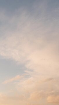 Clouds in Orange Sky at Sunset (Vertical, Timelapse)