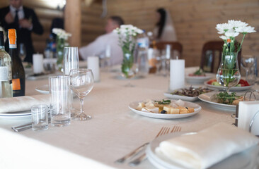 Table set for an event party or wedding reception. Empty glasses set in restaurant.