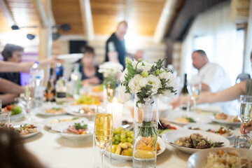 Table set for an event party or wedding reception. Empty glasses set in restaurant.
